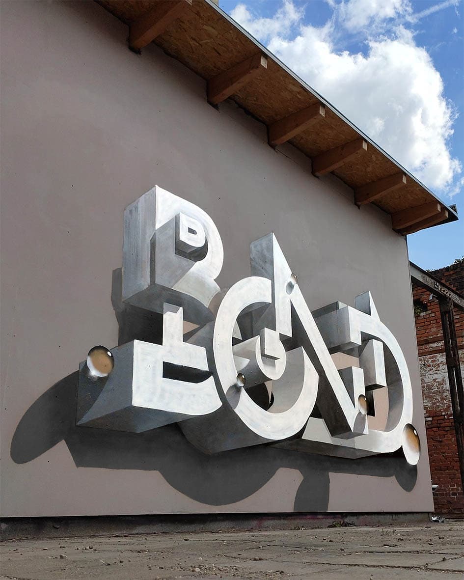 Œuvre de street art en trompe-l’œil représentant des lettres en 3D réalisée par Bond Truluv à Leipzig, en Allemagne.
